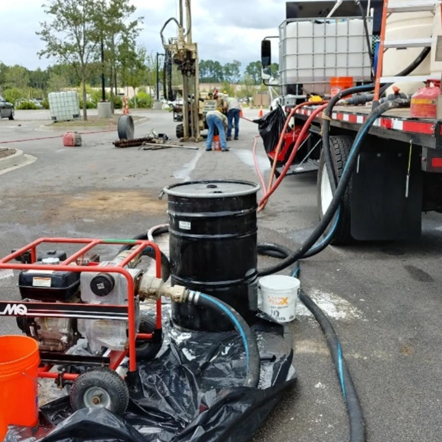 Field injection equipment, mixing tanks, pumps, and hoses used to deliver mZVI and enhanced bioremediation amendments for chlorinated solvent groundwater remediation in Bluffton, South Carolina.